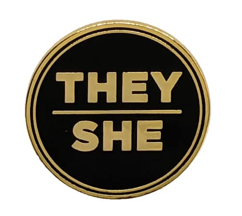 They She Black and Gold Circular Hard Enamel Pronoun Pin | Nonbinary Femme Pronoun Button Badge, 1.25 inches, Metal